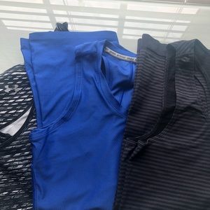 Three athletic tank tops